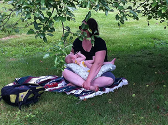 Nursing on the road, under an apple tree. Photo credit: Sean Smith